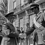 Francisco Franco junto a [PERSONAJE] durante encuentro oficial Juan Carlos de Borbón, Príncipe de España, a su llegada a un acto celebrado en el Instituto de Cultura Hispánica, con motivo del Día de la Hispanidad.